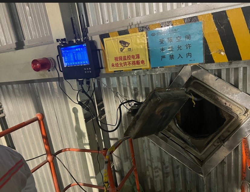 Confined space monitoring station at a manhole entry — gas readings and entry control at the hatch